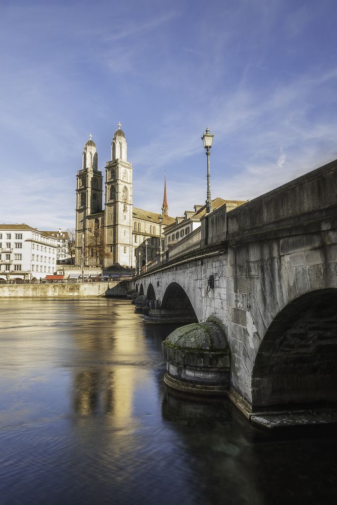 Zurich old bridge and church on a sunny day