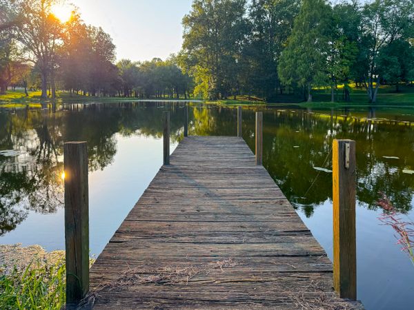 Dock view over pond at dusk