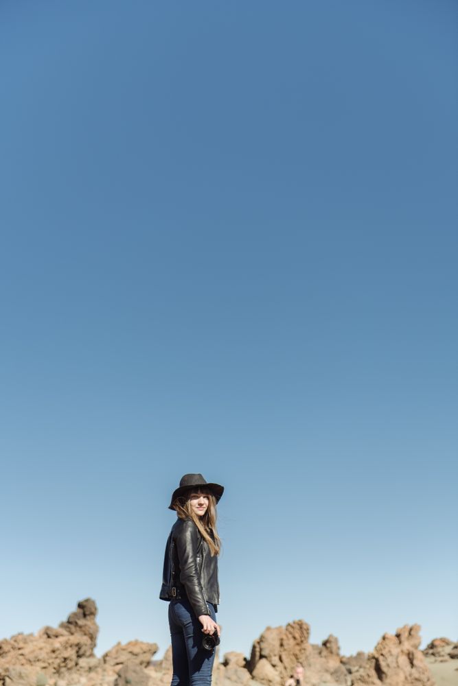 Woman with camera in desert