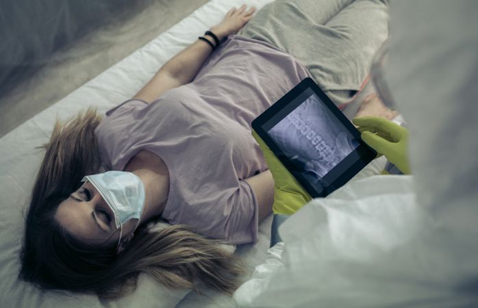 Sick woman lying on a stretcher in a hospital