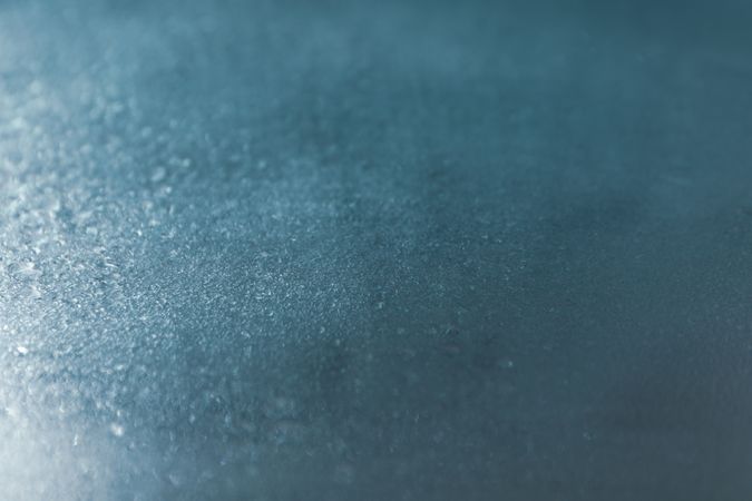 Metallic blue table with droplets