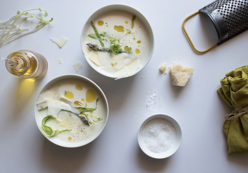 Kitchenware and condiments near asparagus cream soup