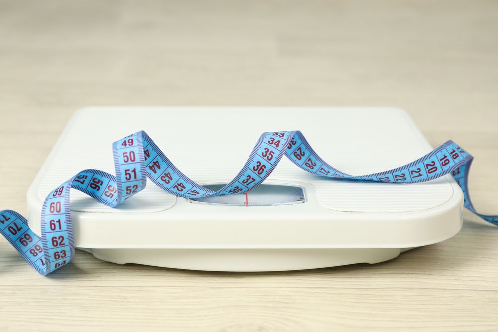 Scales and measuring tape. Weight loss concept