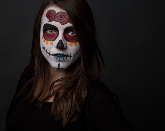 Young woman with creepy face paint