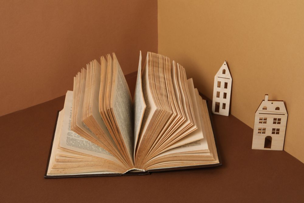 A children's book with toys on a beige background.