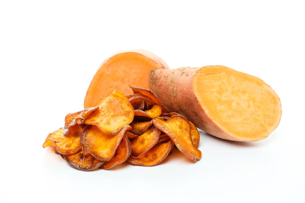 Concept of tasty food - sweet potato fries, isolated on light background