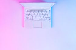 Laptop with vibrant bold gradient holographic lights