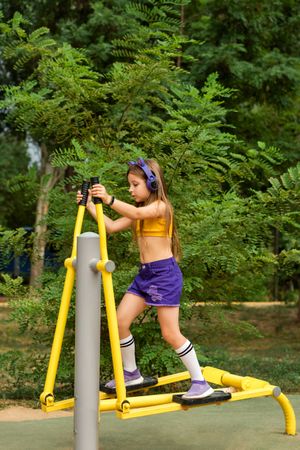 Schoolgirl playing on sports ground