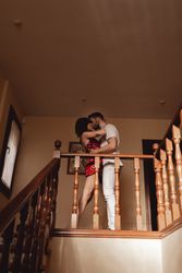 Couple kissing on stairway