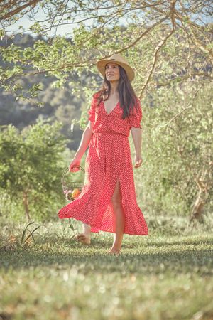 Happy woman walking in countryside