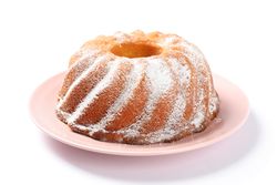 Cake with powdered sugar isolated on plain background