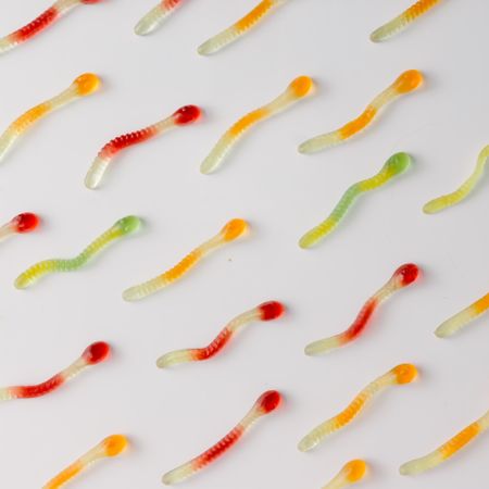 Colorful pattern made of gummy candies on bright background