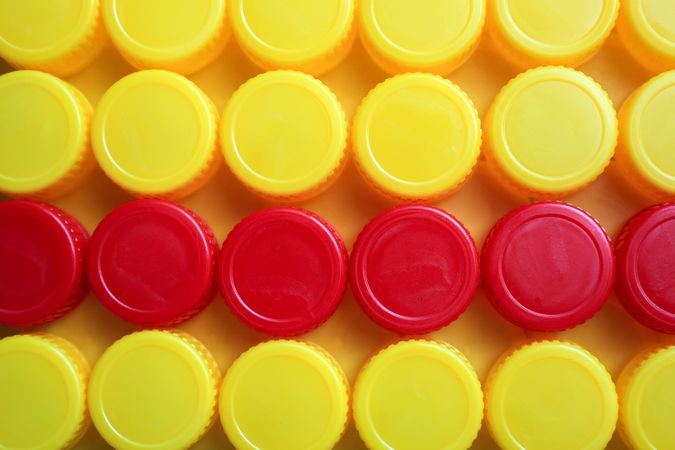Yellow and Red Plastic Bottle Cup Background