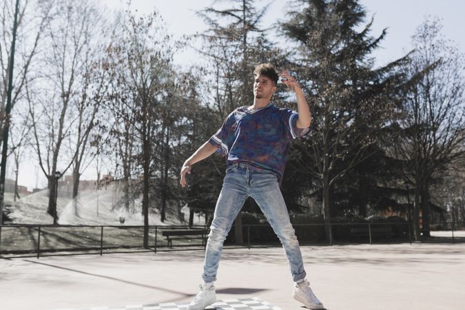 Man dancing break dance in park