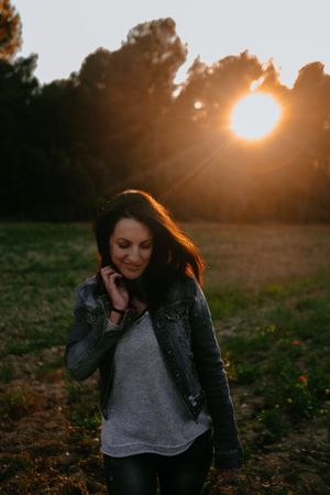 Woman walking on meadow and enjoying freedom