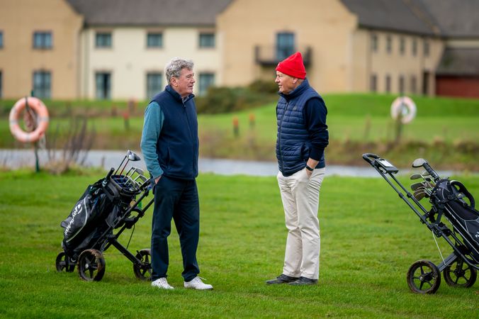 Two men chatting at golf course