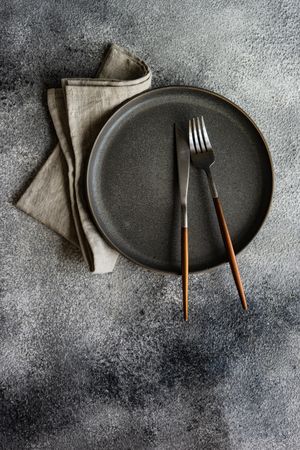 Top view of table setting with elegant grey plate