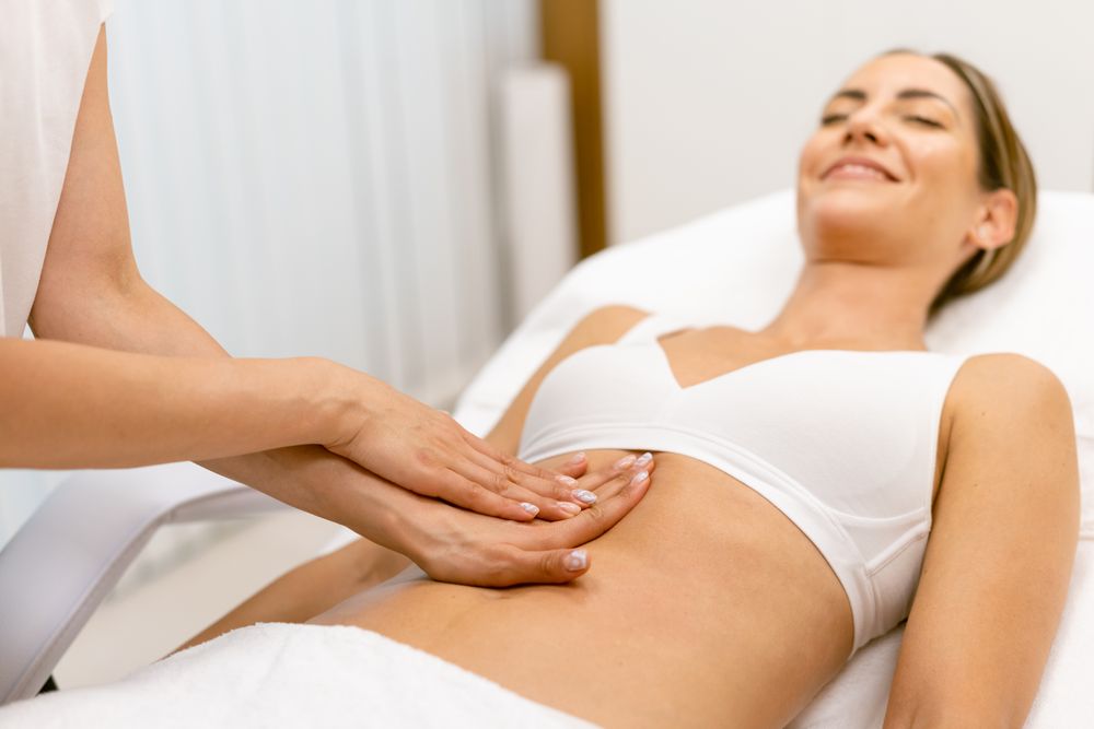 Relaxed female having a lymphatic massage at spa