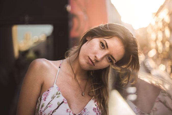 dreamy woman against sunny blurred background