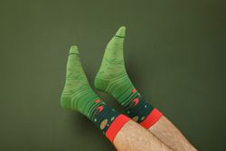 Colored socks with a print on men's feet.