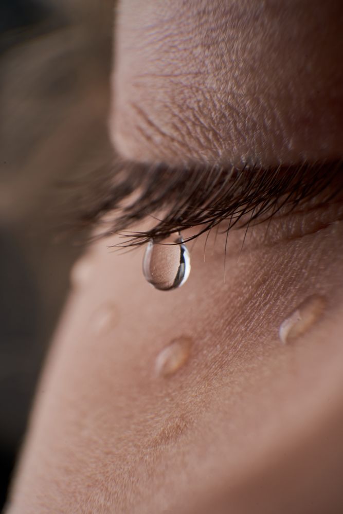 Unrecognizable depressed kid with tears