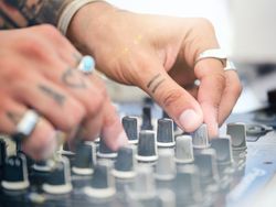Crop DJ playing music with controller