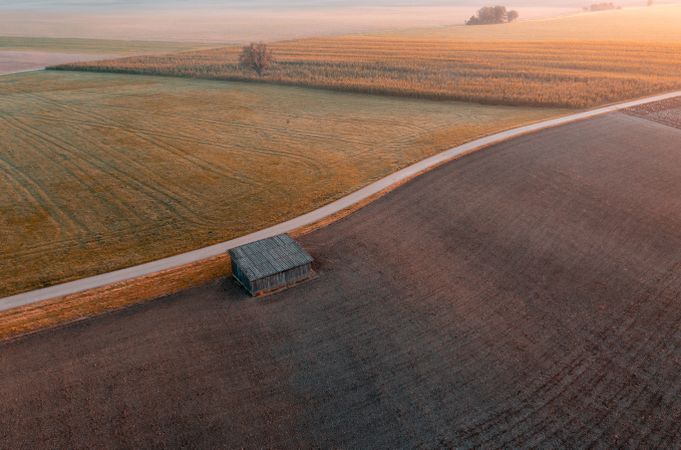 Agricultural fields aerial view at sunrise, in a german village