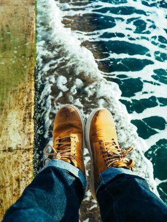 travelling in the summer wearing yellow shoes with seashores in the background.