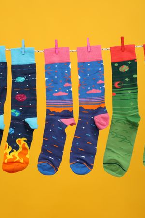 Casual clothes and wearing concept - socks, clothes for foot
