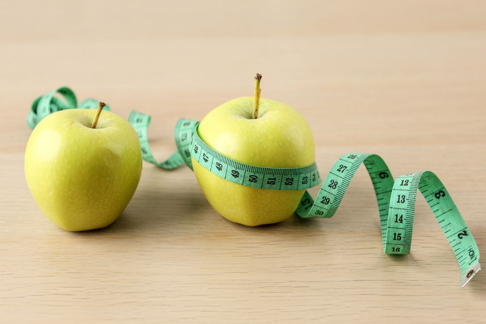 Two Green Apple and Measuring Tape