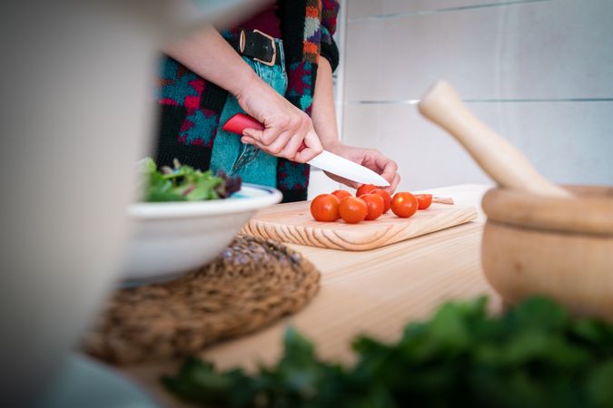 Woman preparing vegetable salad