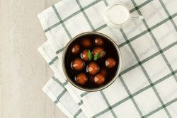 Top view of bowl of  kolak candil with space for text