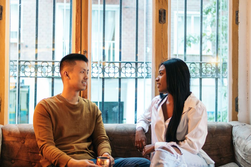 Asian man and Black Latina woman on a date