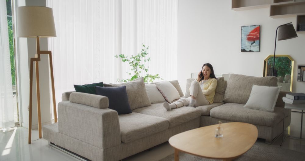 Sitting on a Couch in Her Cozy Modern Living Room