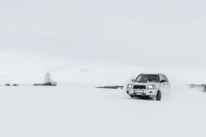 Car driving on snow field