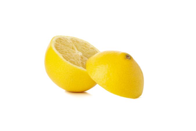 Fresh lemon isolated on light background. Ripe fruit