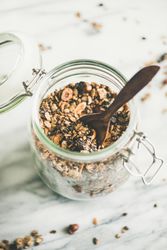 Top view glass container of homemade granola