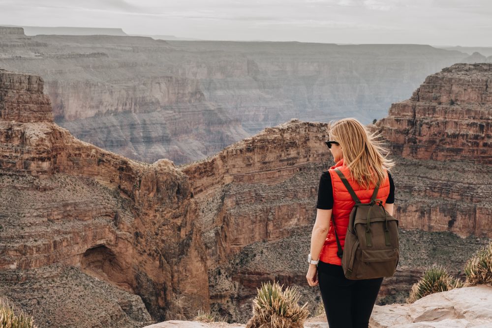 Calm female looking at pictorial landscape