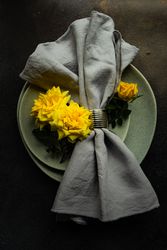 Grey table setting with yellow roses