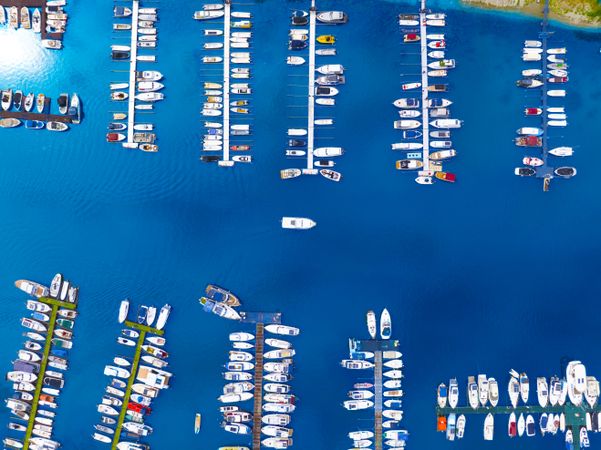 Top down travel photo of a vessel navigating into a port.