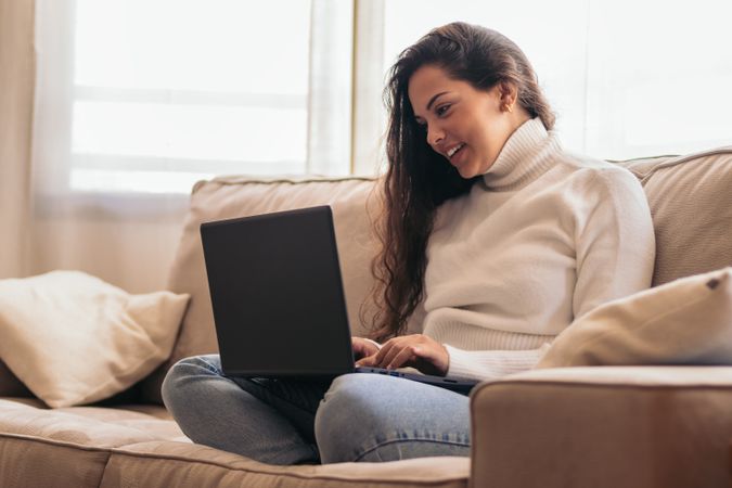 Home Productivity: Young Woman Working on Laptop