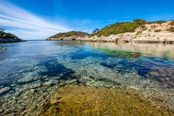 Cala Portinax bay with beautiful azure blue sea water