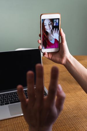 Crop woman having video call via smartphone