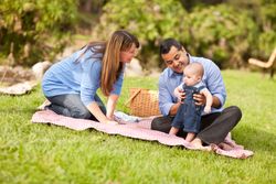 Happy Family Playing In The Park