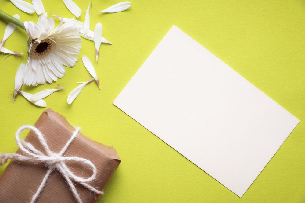 Top view of blank message card with figs on green background
