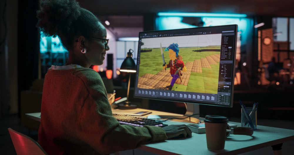 Portrait of Black Female Video Game Designer Creating Metaverse and Design Video Game Character in Creative Office at Night.
