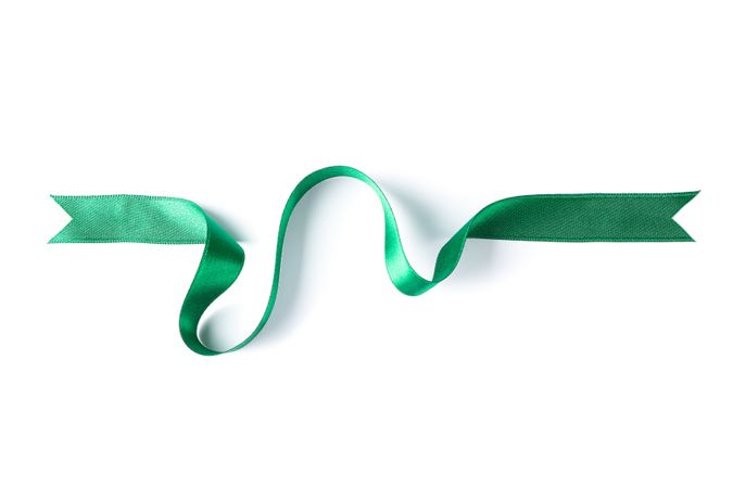 Green ribbon isolated on blank background. Gift concept