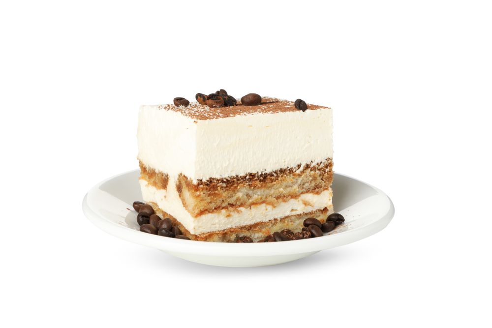 Sweet tiramisu isolated on blank background. Tasty dessert