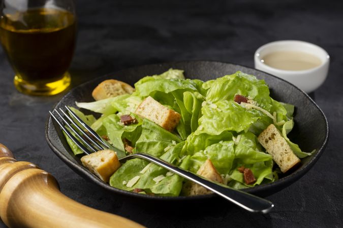 Caesar salad with croutons and bacon.