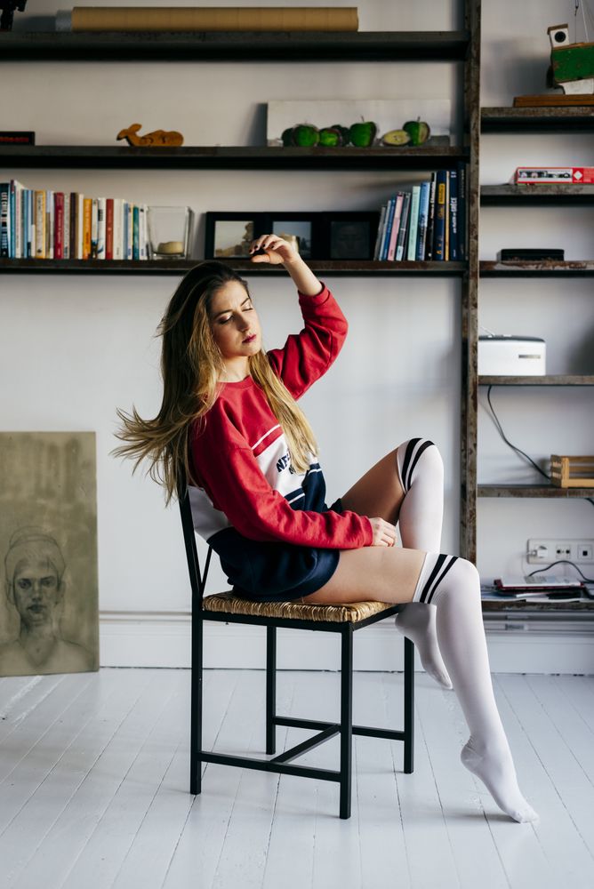 woman sitting on chair in stylish room
